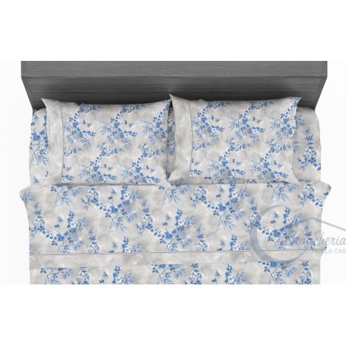 Drap en pur coton avec fleurs stylisées sur le bleu