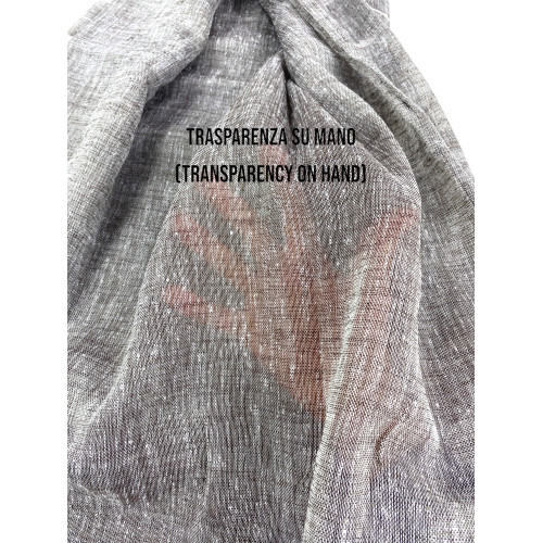 Semi-transparent fabric of the Lara curtain with transparency on the hand.