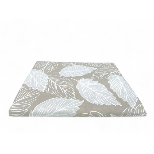 Beige cotton fabric detail with leaf motif of the cover