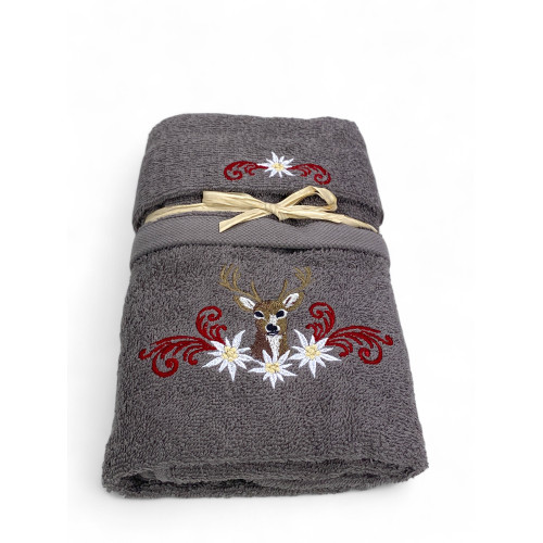 Grey towel with central deer and mountain-style floral decorations